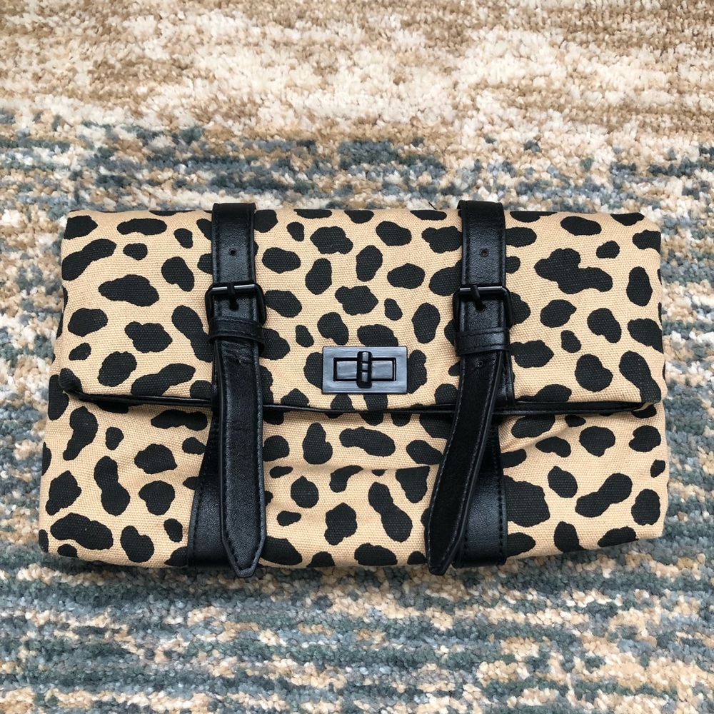 Leopard print fabric clutch.